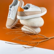 light beige suede sneakers. Behind view